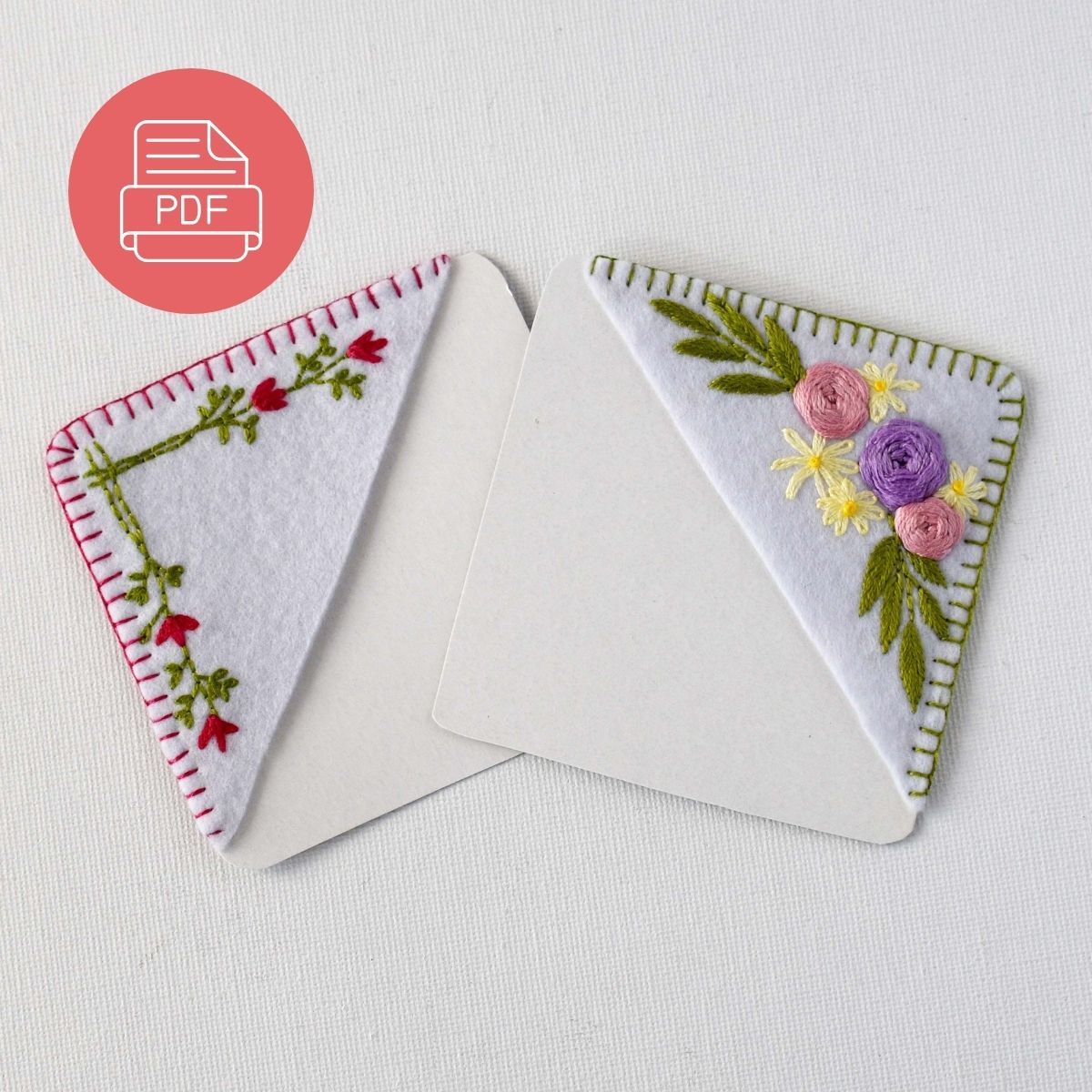two hand embroidered corner bookmarks with flowers
